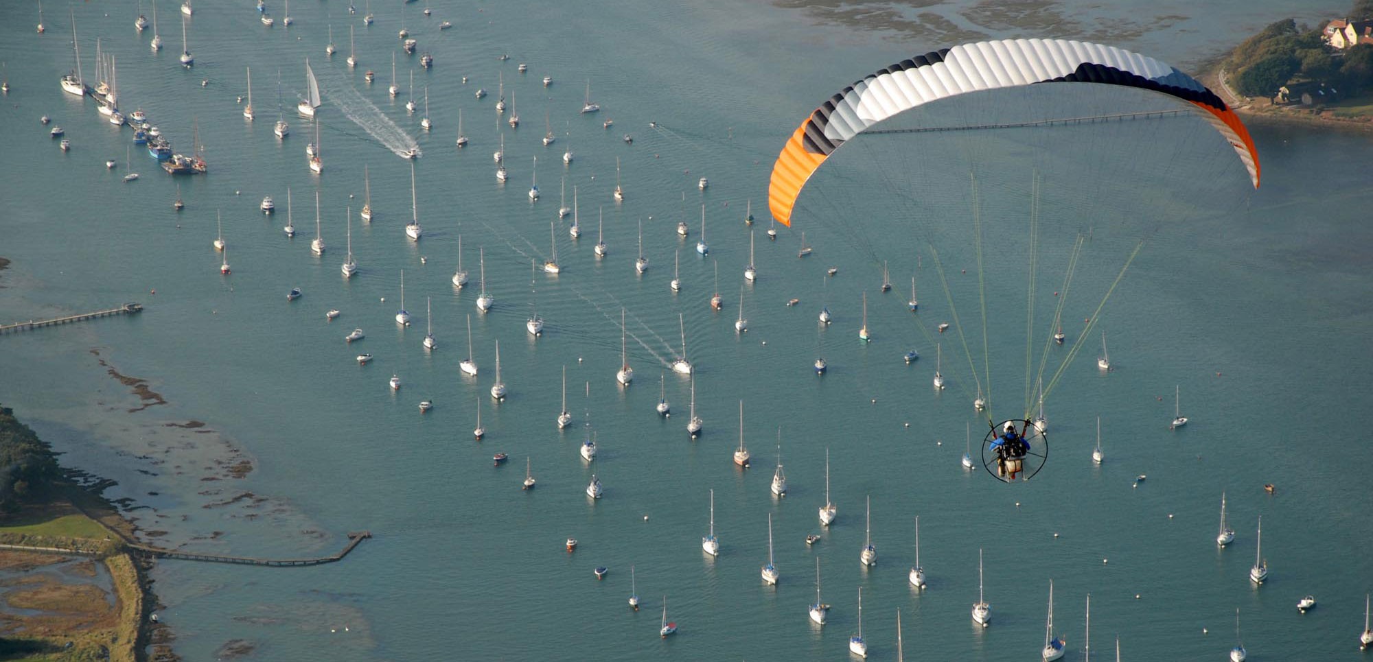Ben flying over the Estuary at Chichester