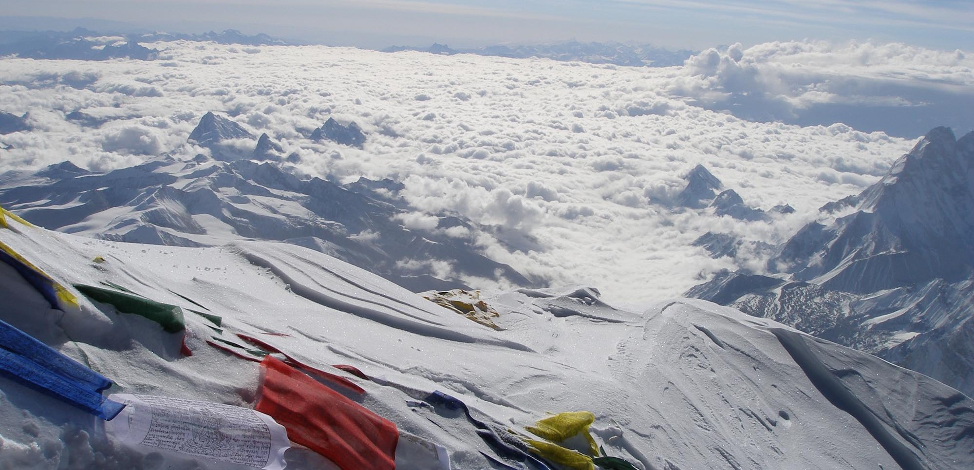 Prayer flags strewn on the summit of Mount Everest
